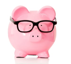 Geeky piggybank with glasses - isolated over a white background.jpeg